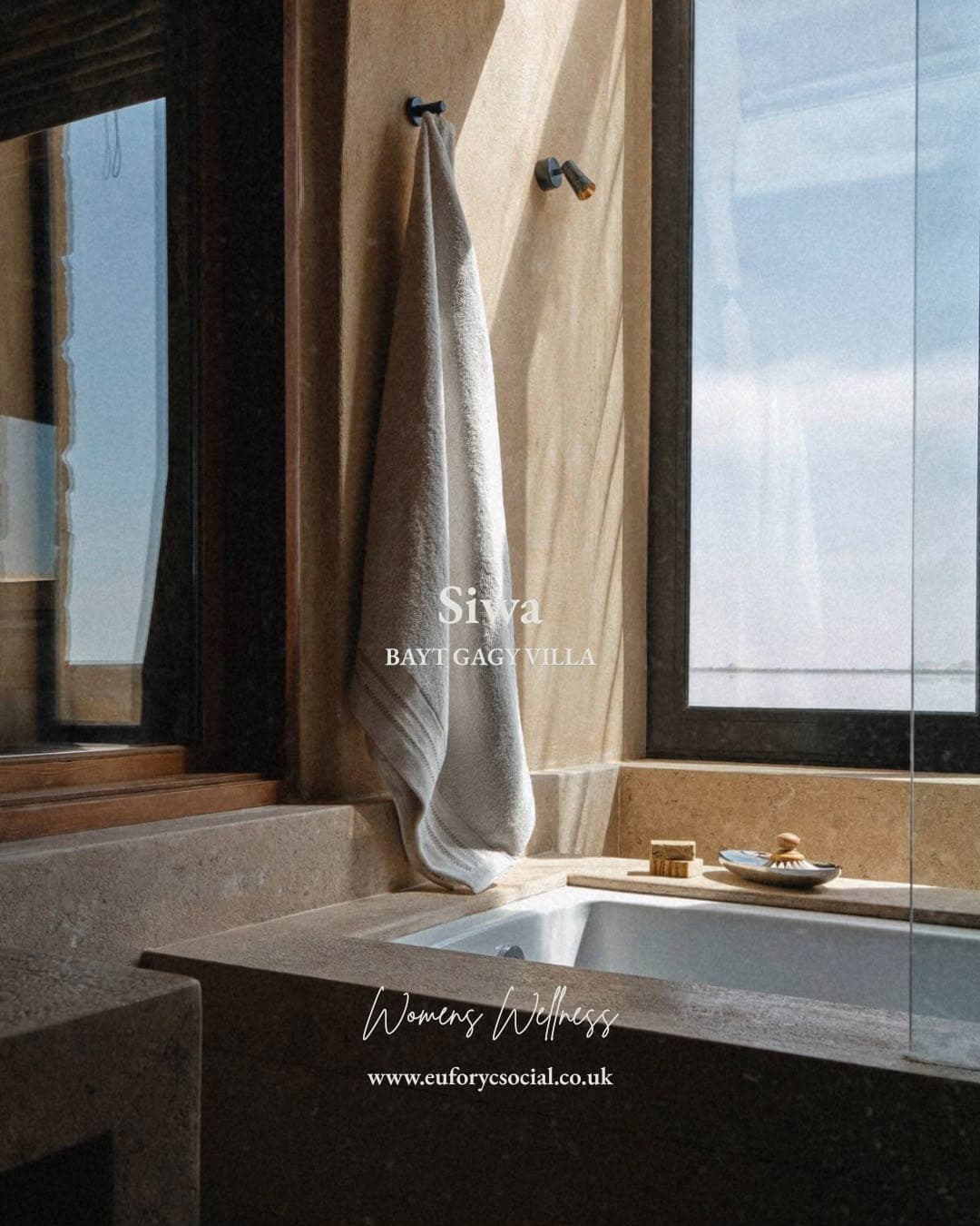 A marble bath at Bayt Gagy Villa beside a window over the salt lake