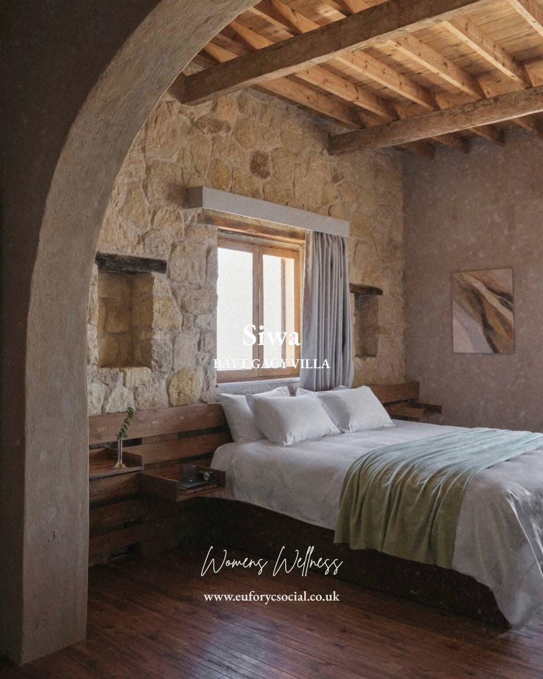 A stone-arched bedroom at Bayt Gagy Villa with timber beams